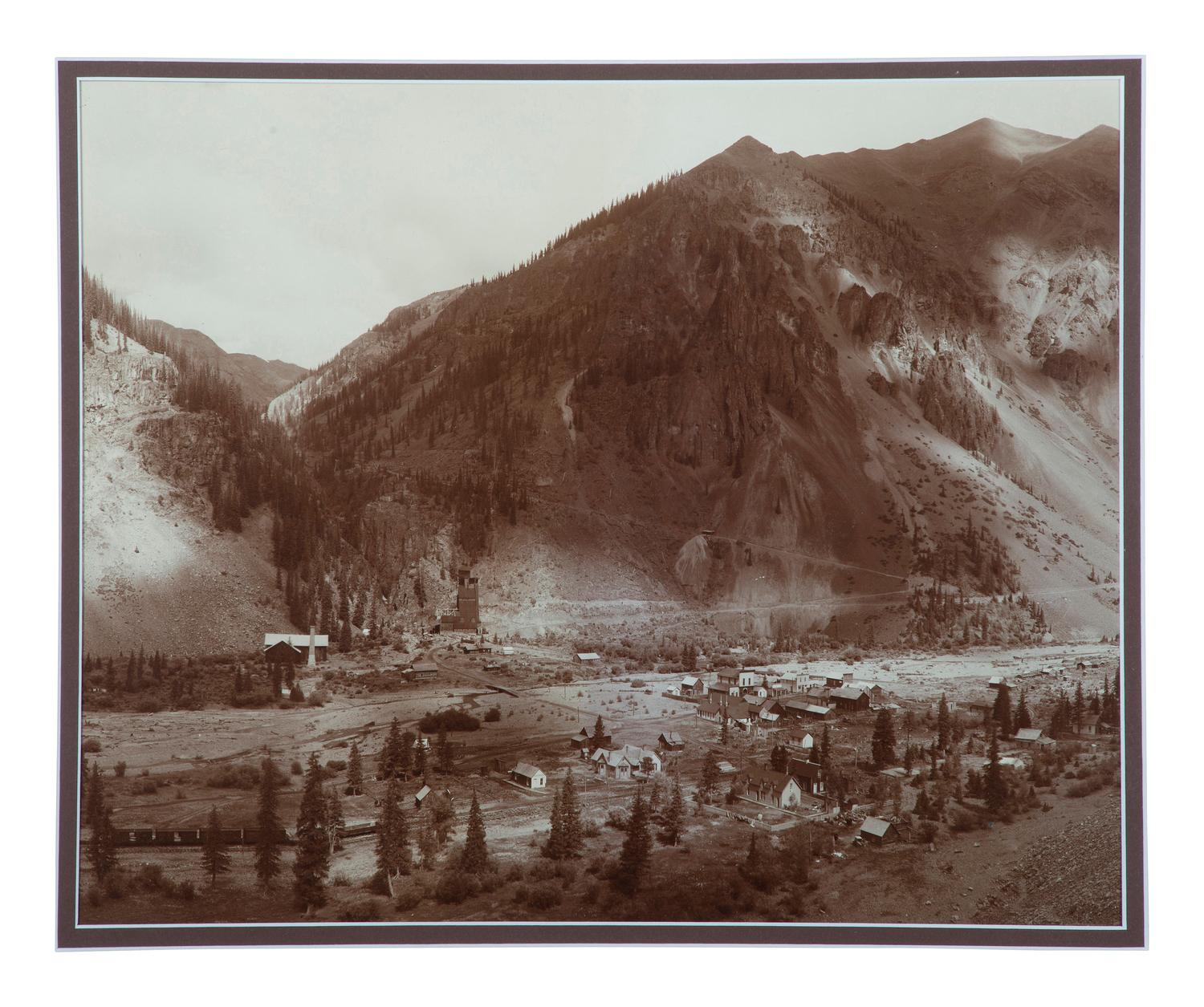 [WESTERN TOWNS]. Silver gelatin photograph a distant view of a possible western mining town.