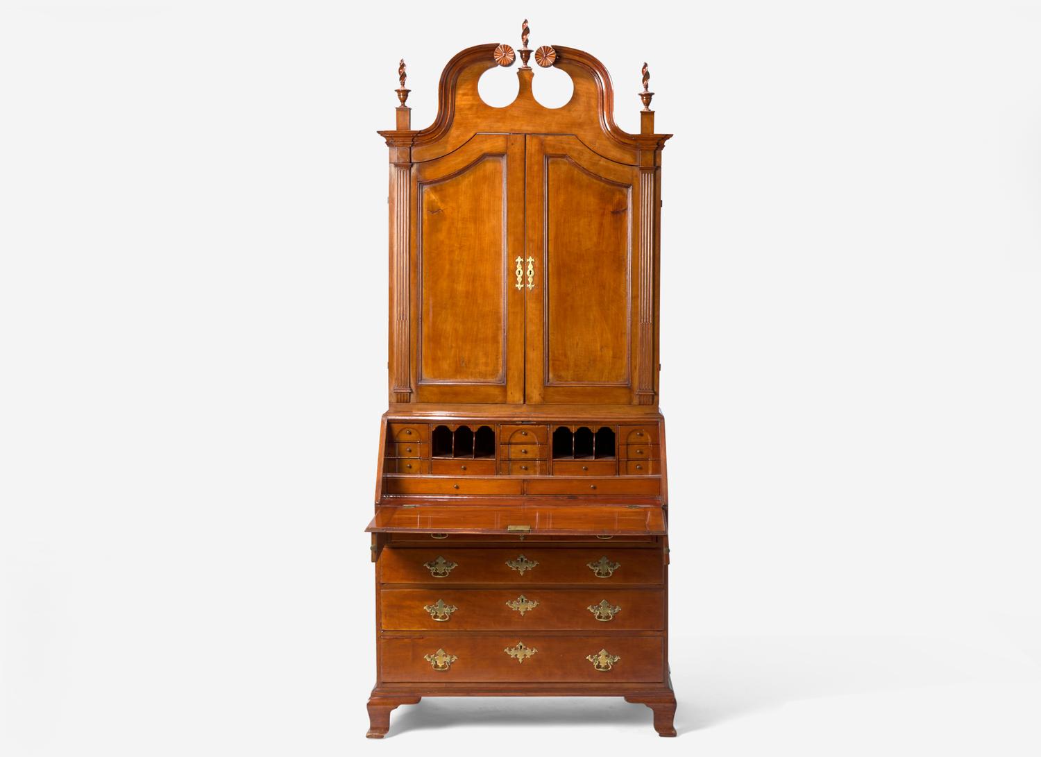 A Chippendale Carved Cherrywood Desk and Bookcase