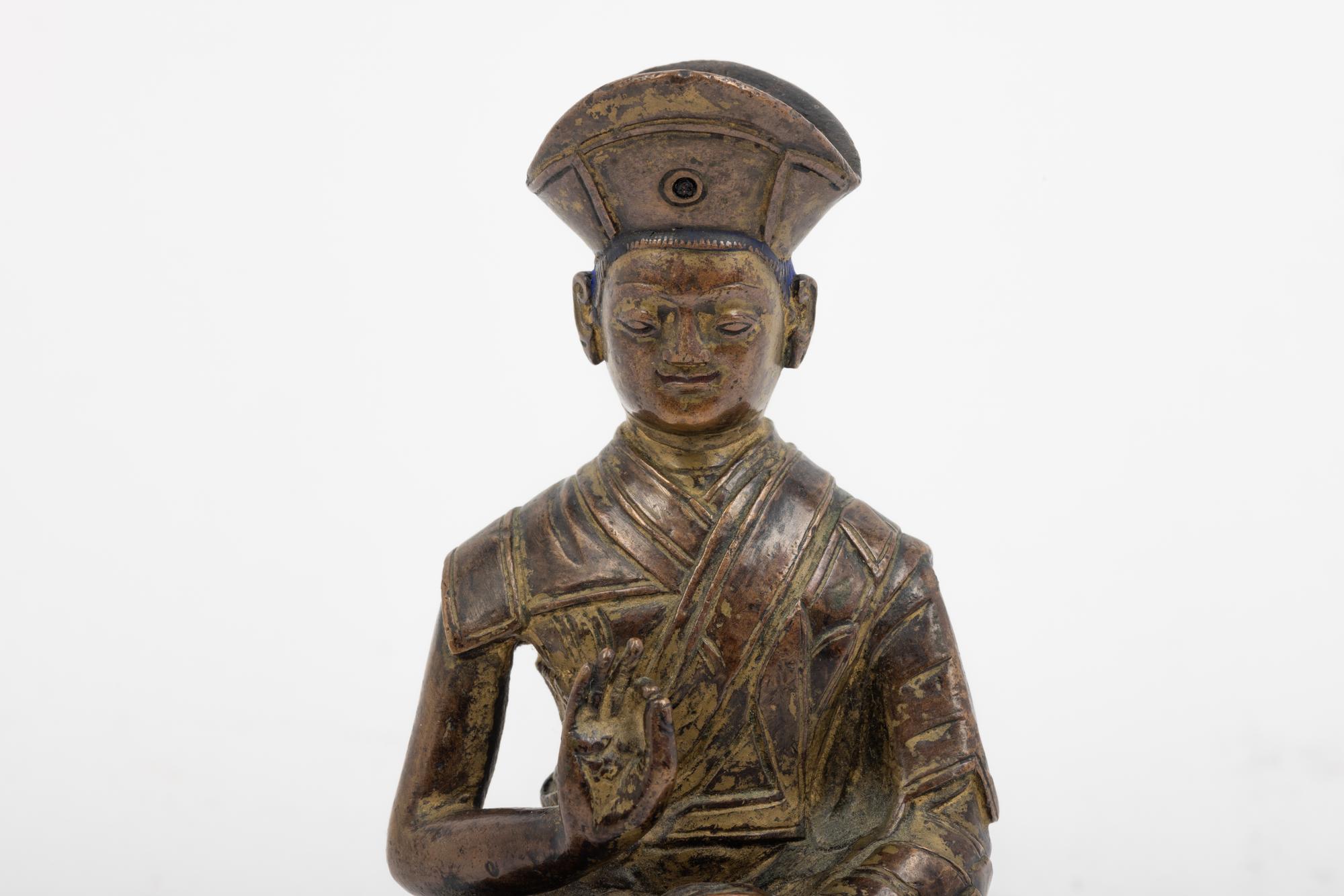 A Tibetan Bronze Figure of a Lama