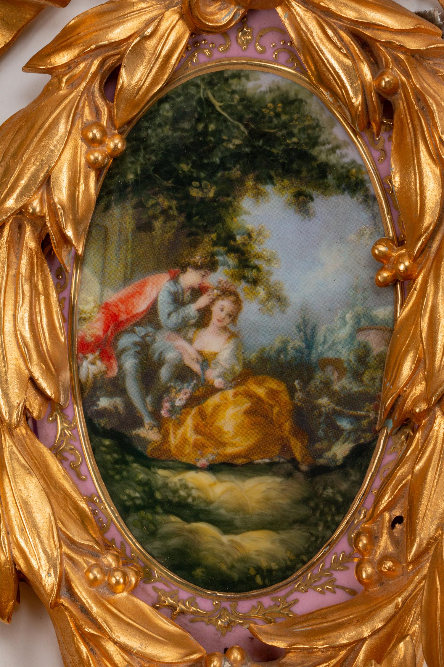 A Pair of Louis XVI Style Porcelain-Mounted Gilt-Bronze Four-Light Sconces