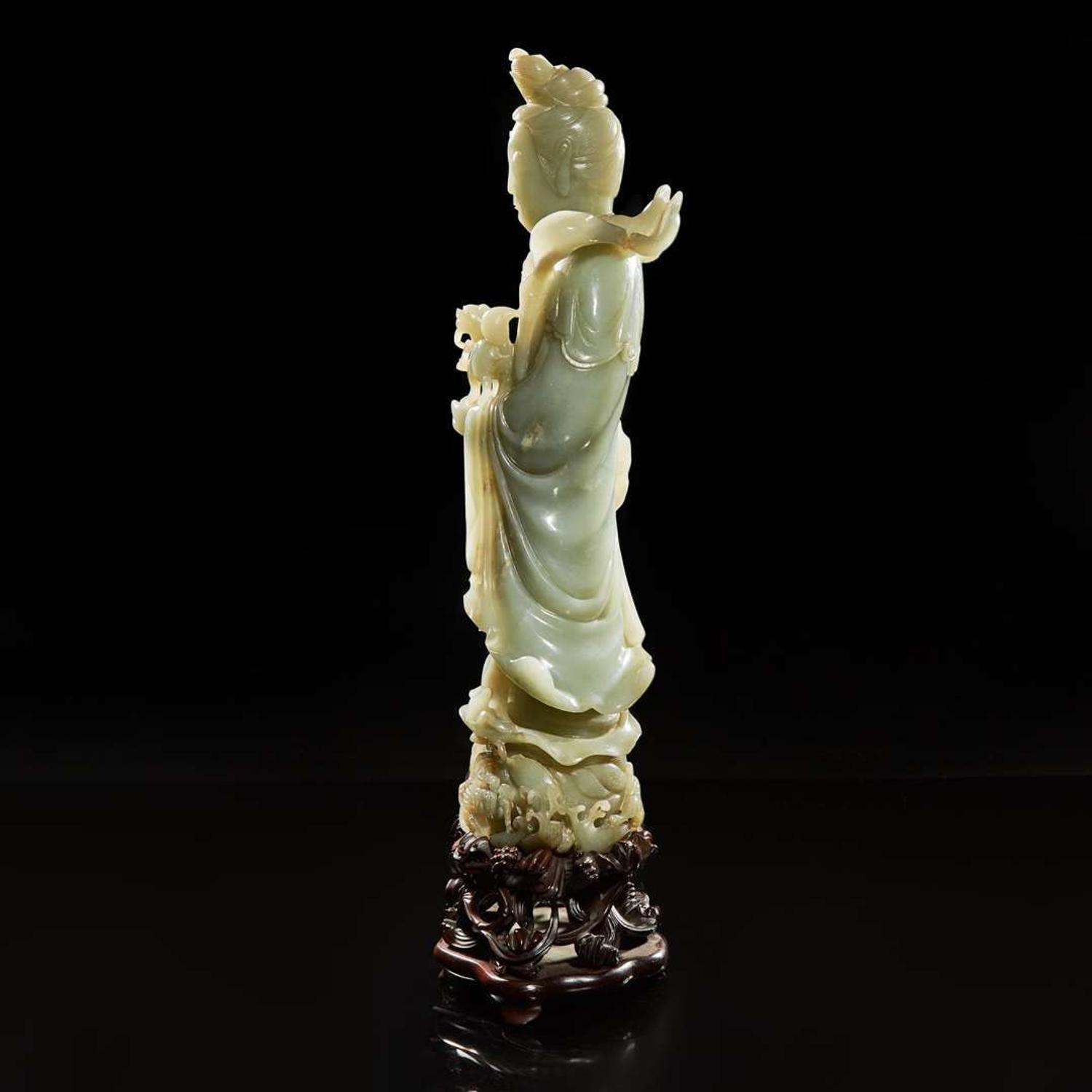 A large Chinese carved celadon jade figure of a bodhisattva 青玉雕觀音 Late Qing to Republic period ?????