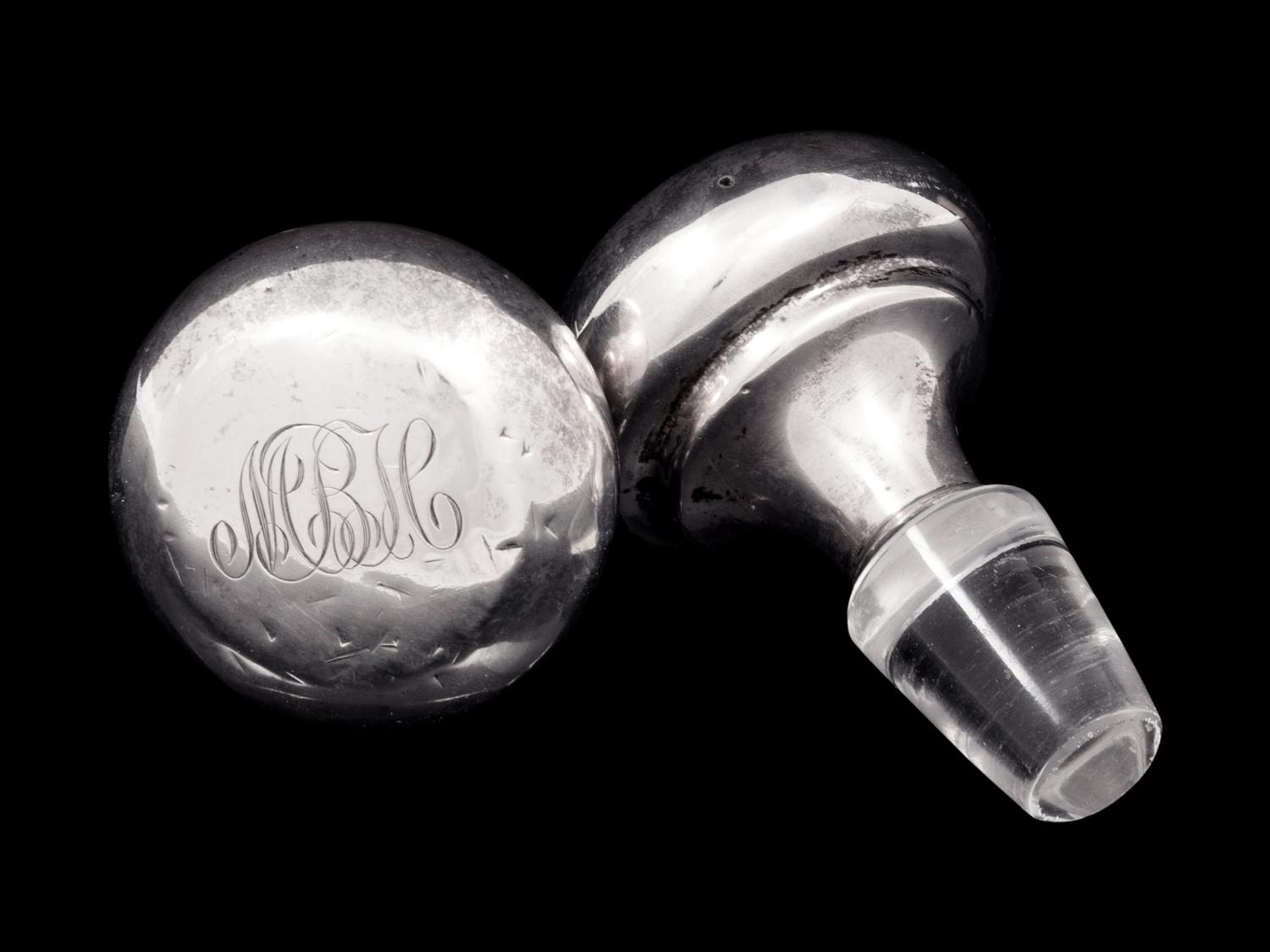 A Pair of American Cut Glass Decanters with Silver Stoppers
