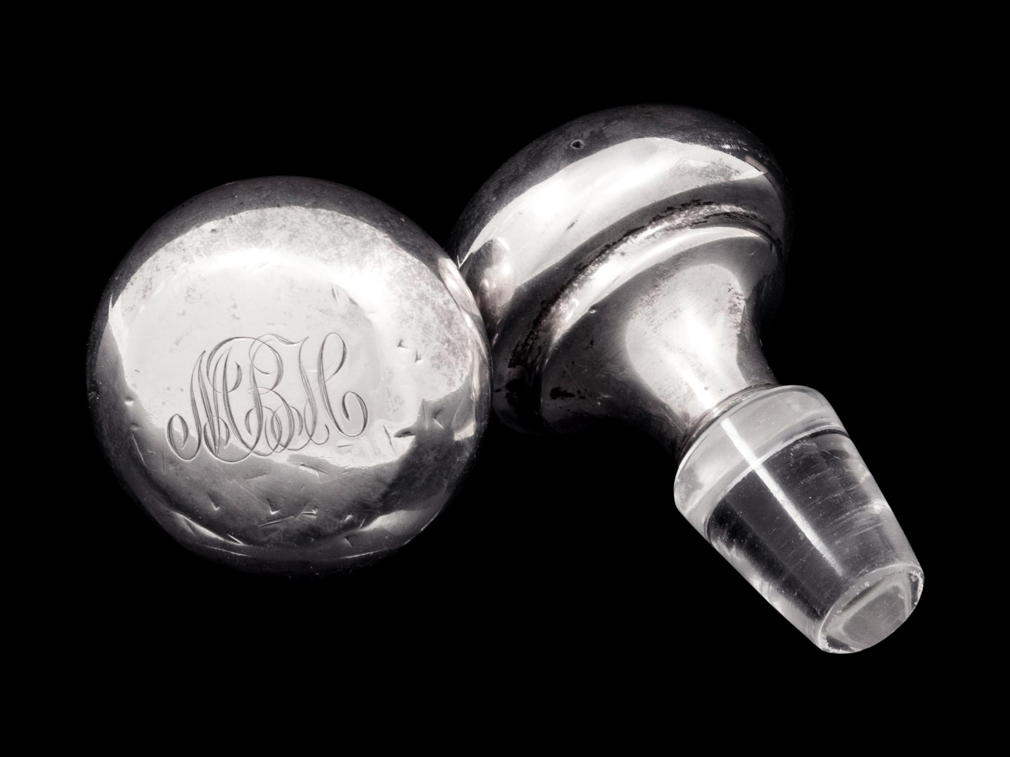A Pair of American Cut Glass Decanters with Silver Stoppers