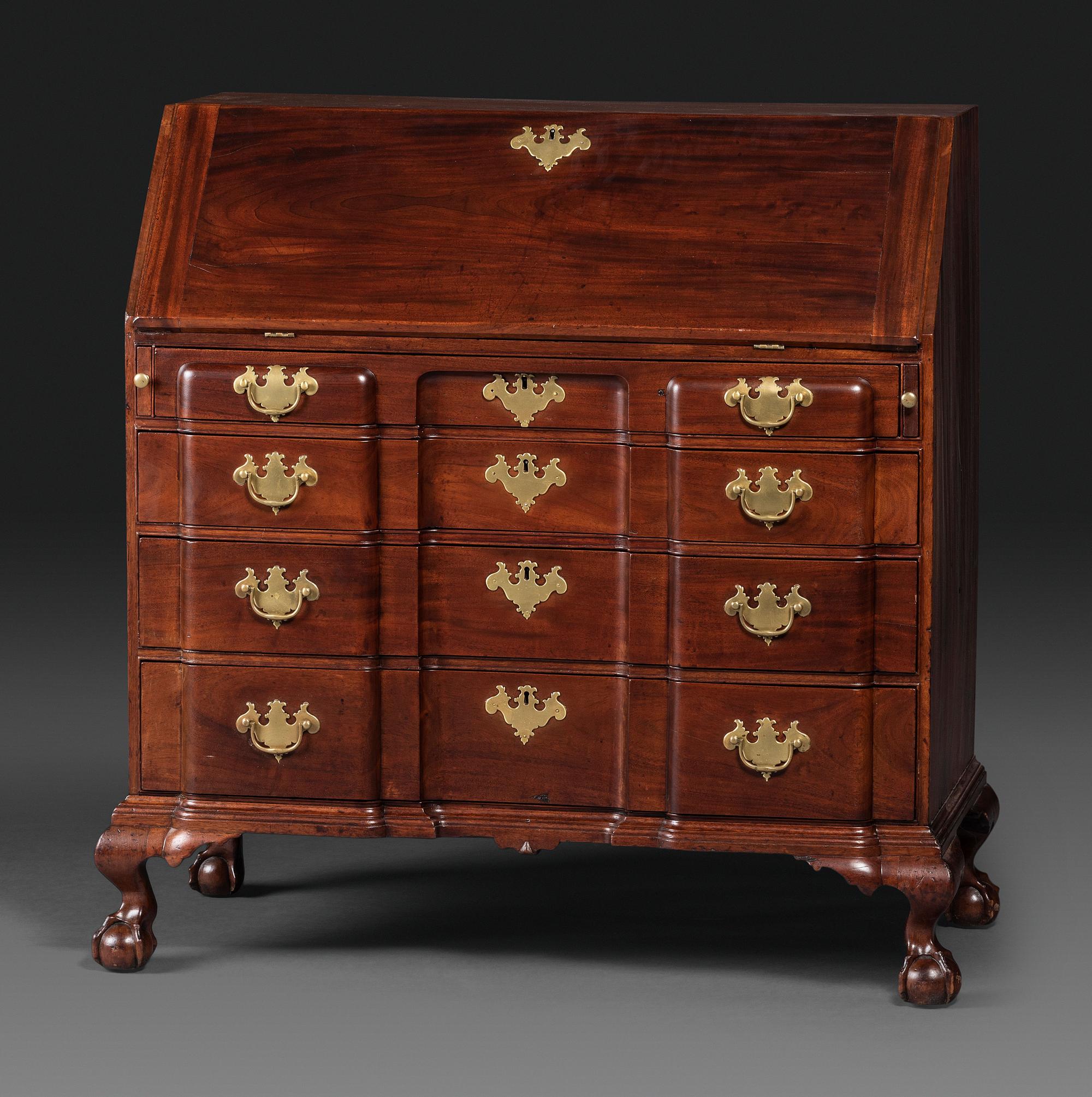 A Chippendale Figured Mahogany Block-Front Claw-and-Ball Foot Slant-Front Desk