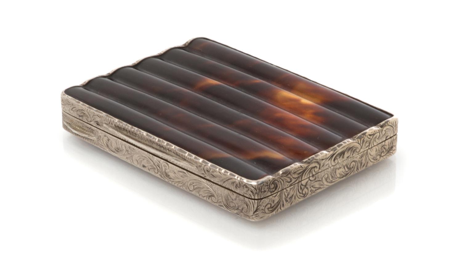 An Austrian Silver and Tortoise-Shell Cigarette Box, Maker's mark obscured, early 20th century, the sides engraved with foliate forms.