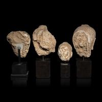 Four Gandharan Terracotta Heads of Buddha, 3rd-5th Century