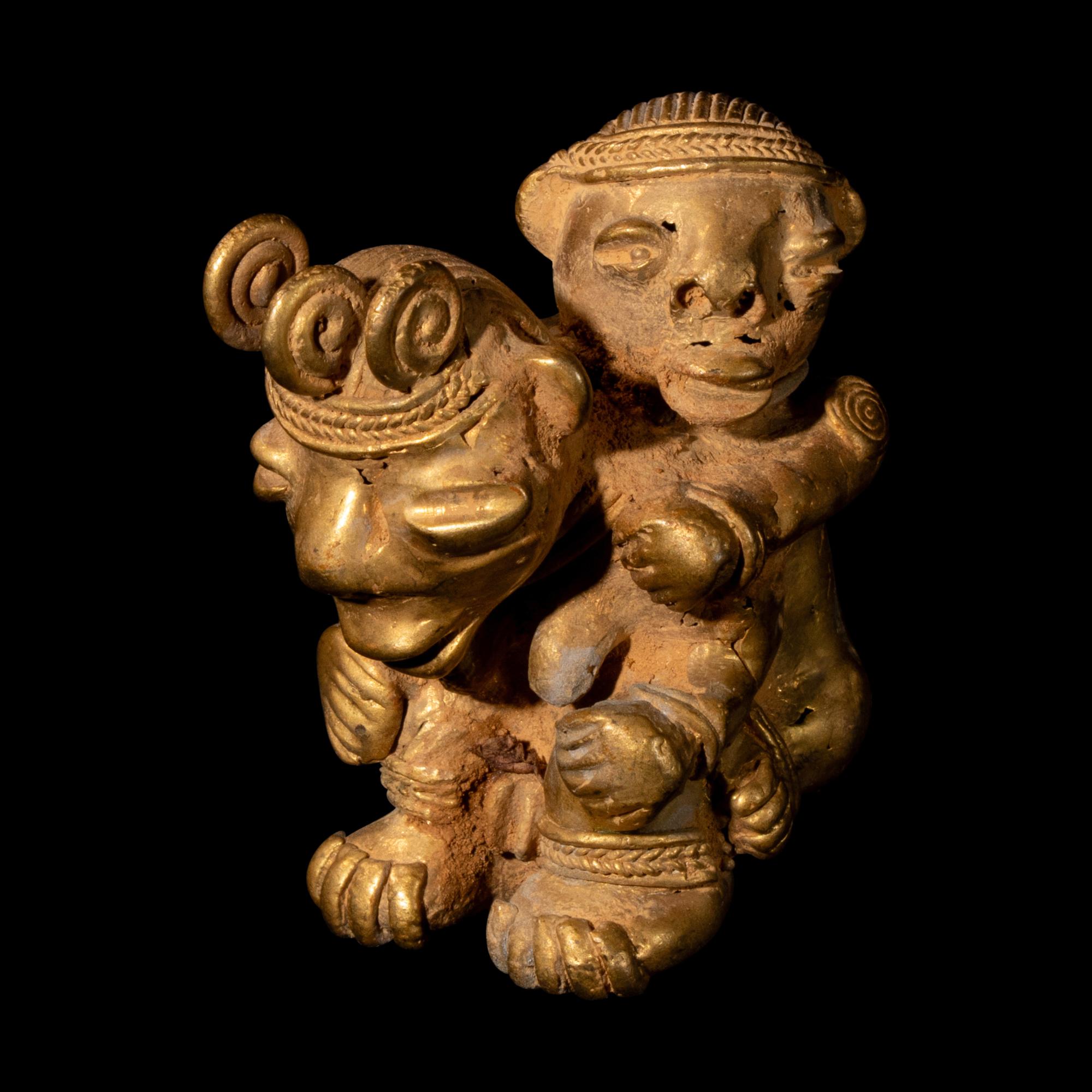 A Tairona Tumbaga Mother and Child Figure
