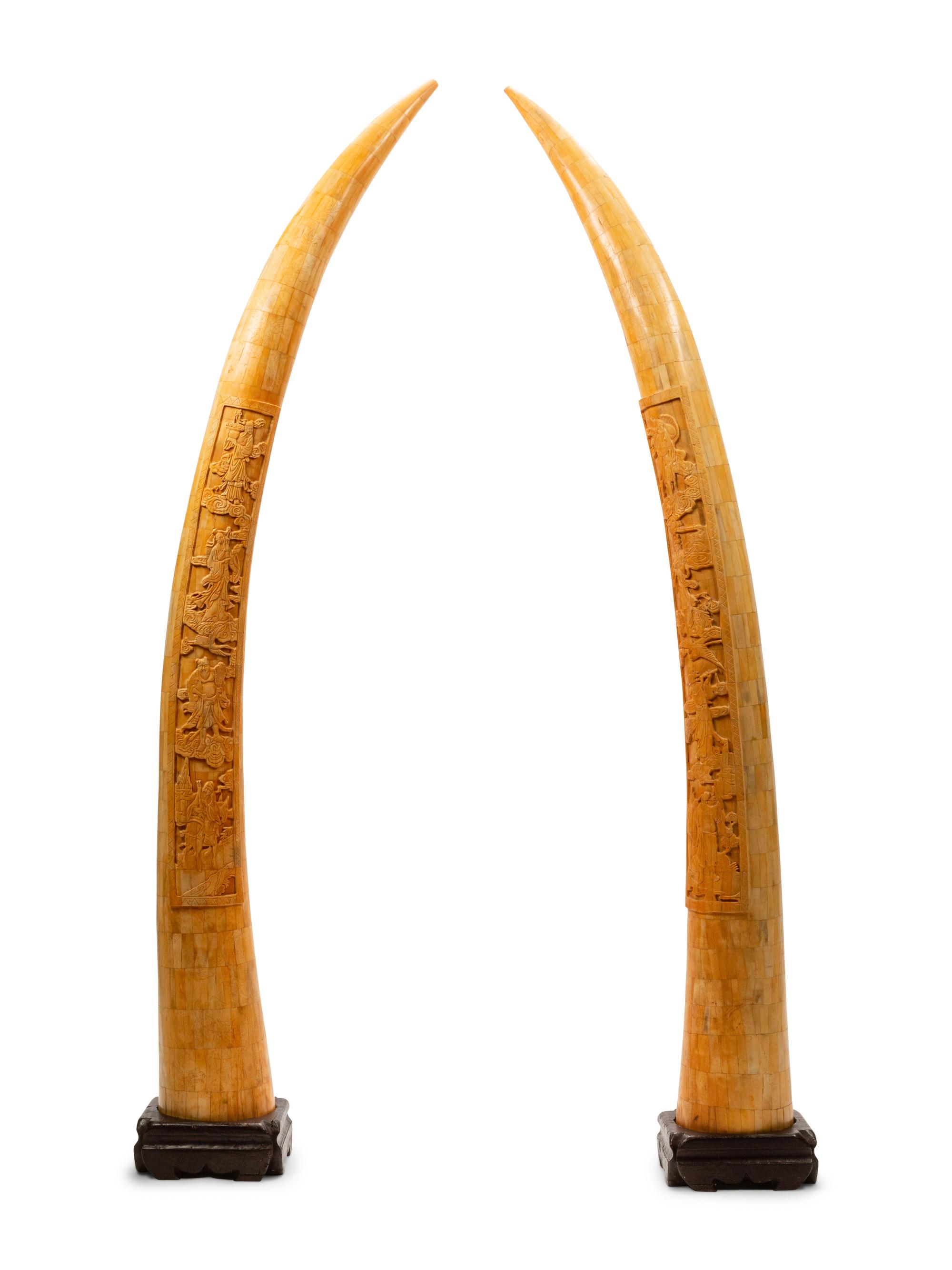 A Pair of Chinese Export Carved Bone Tusks with Wood Bases