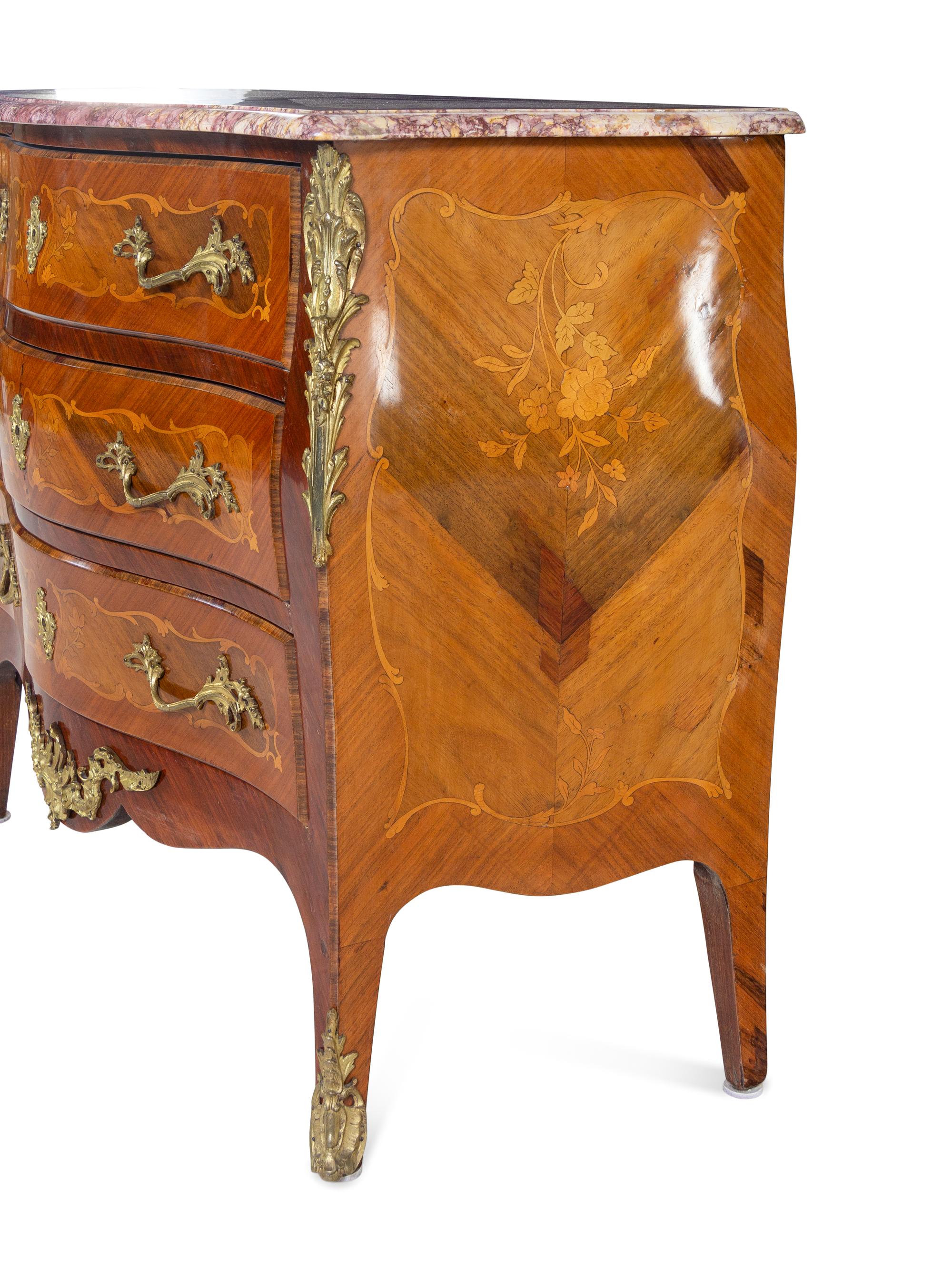 A Louis XVI Style Gilt Bronze Mounted Marquetry Marble-Top Bombe Commode