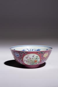 A Ruby Sgraffito Ground Famille Rose and Underglaze Blue Porcelain Bowl