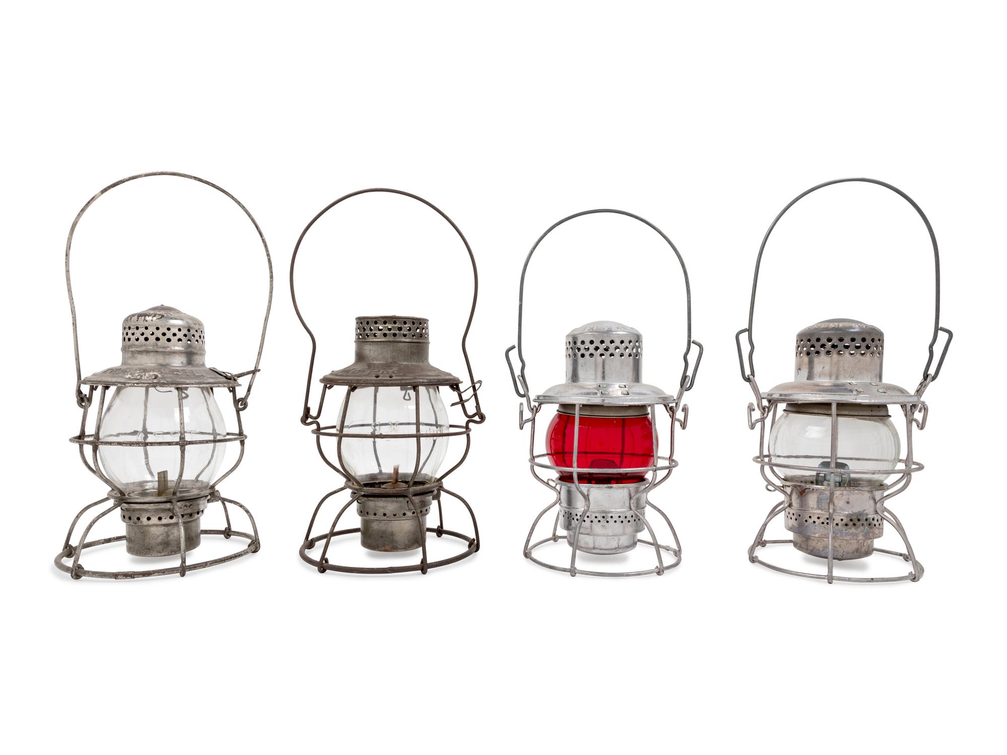 A Group of Four Chromed Metal Railroad Lanterns