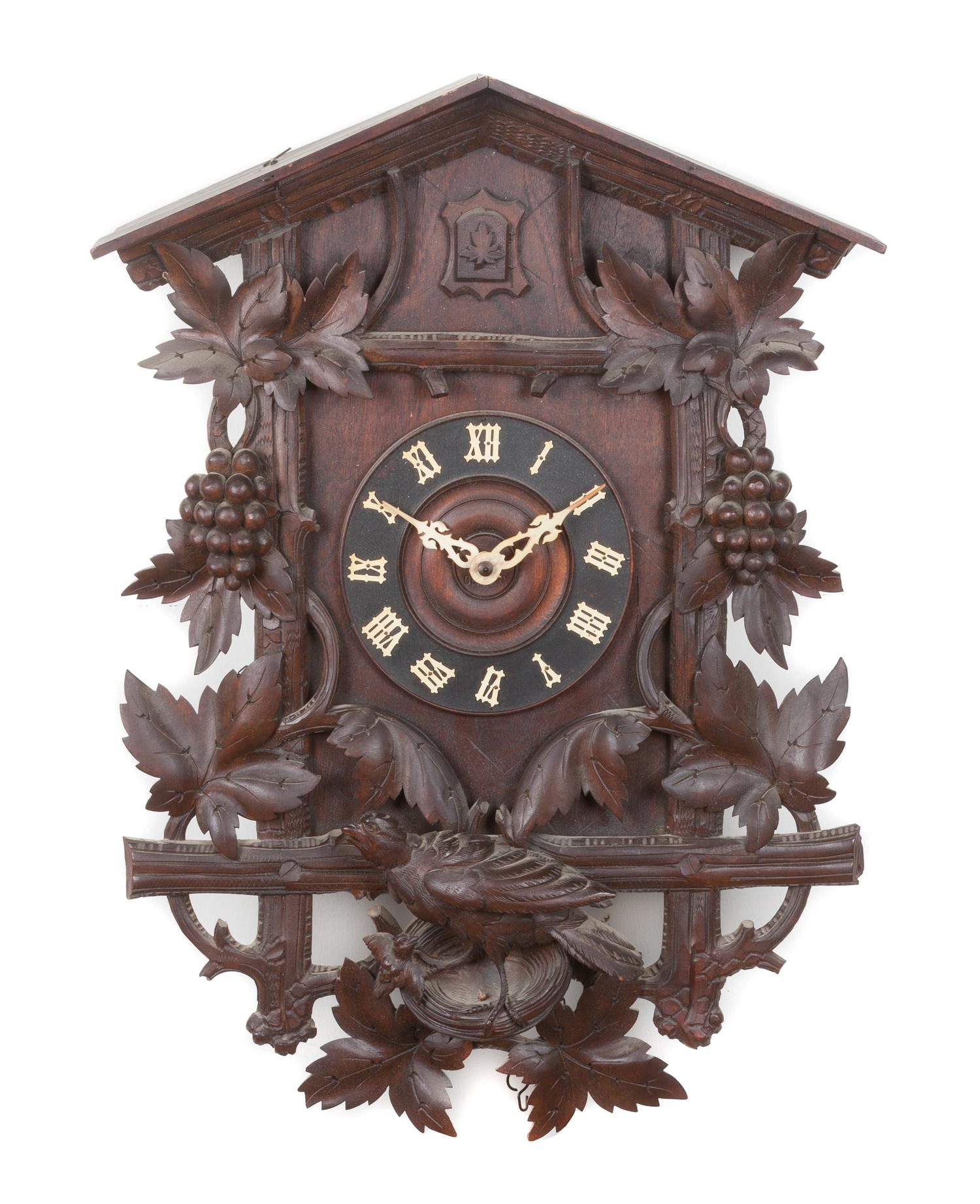 A Black Forest Style Cuckoo Clock Height 33 inches.
