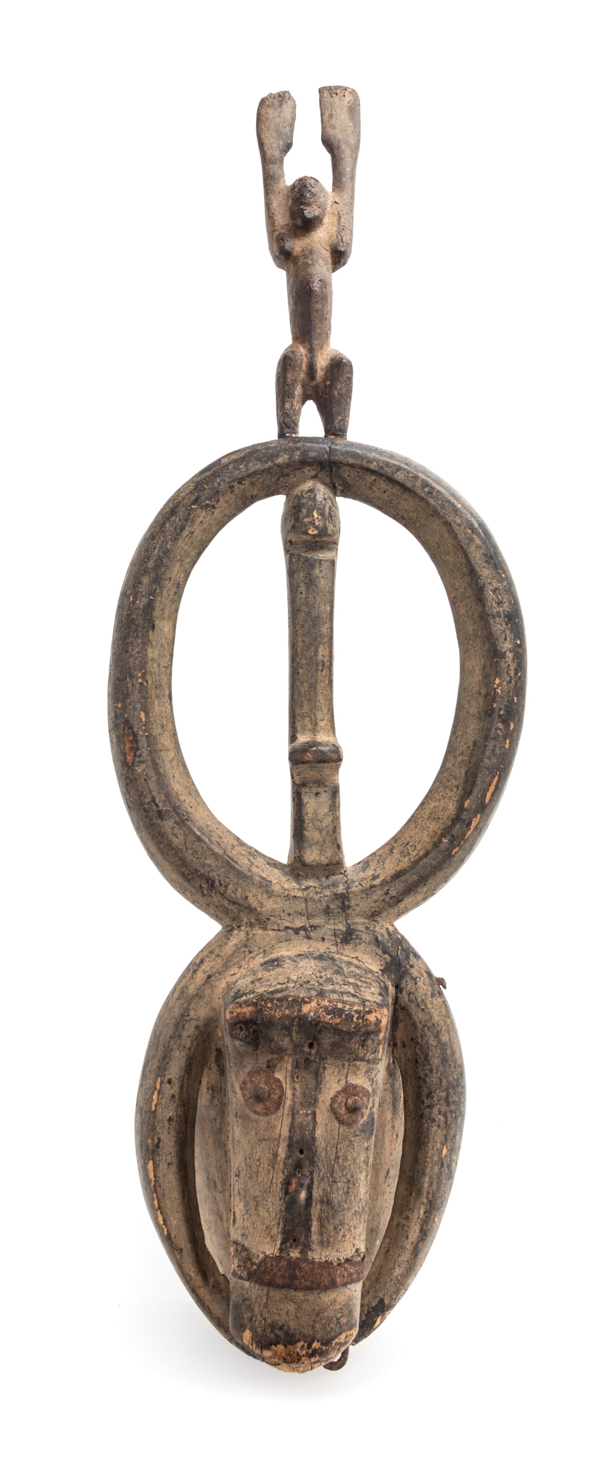 A Dogon Animal Form Wood and Metal Mask Height 30 1/4 x width 7 1/2 x depth 7 inches. — 20TH CENTURY