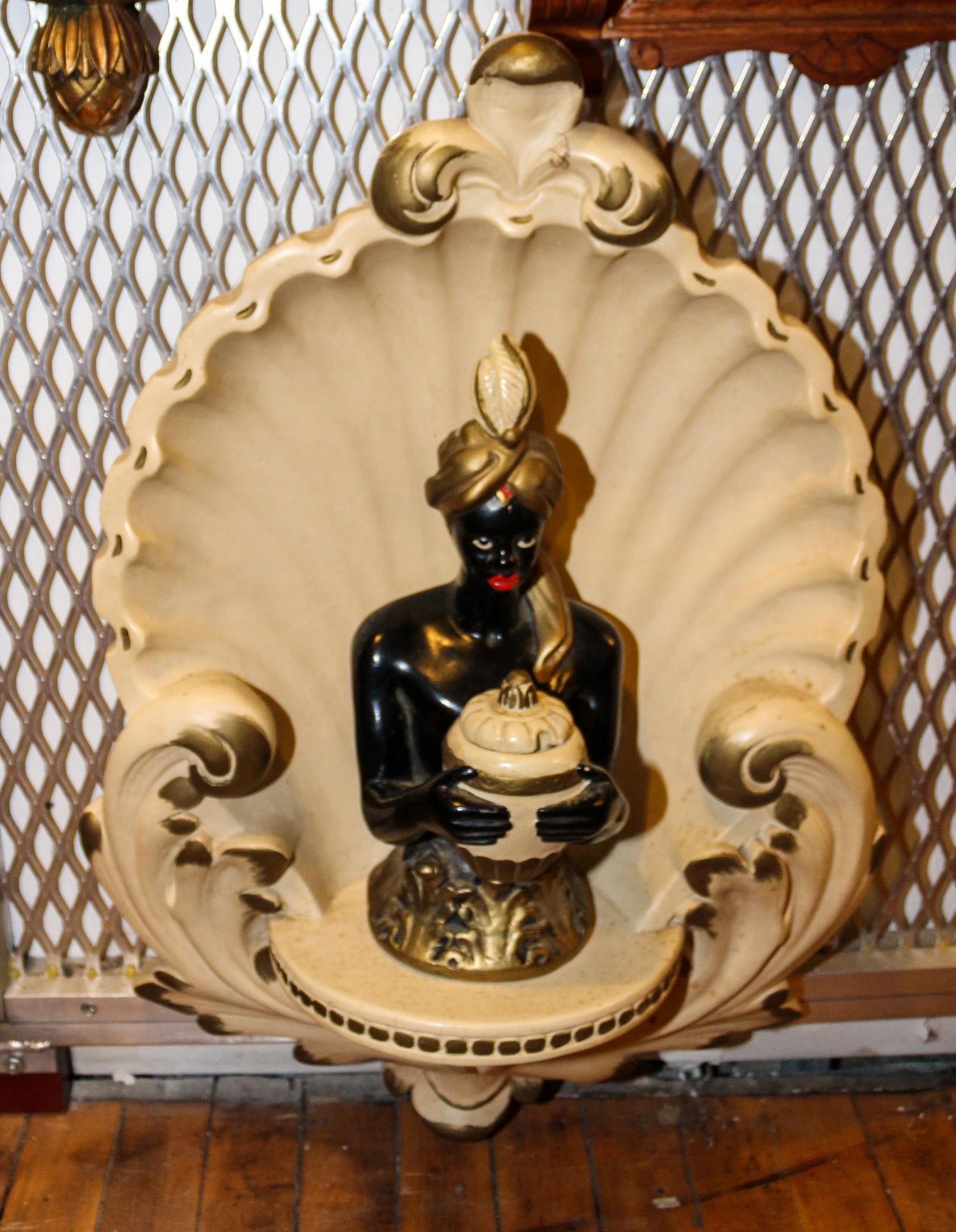 A Continental Painted Blackamoor Height 12 1/2 inches.