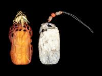 Two Chinese Pierced and Carved Pendants