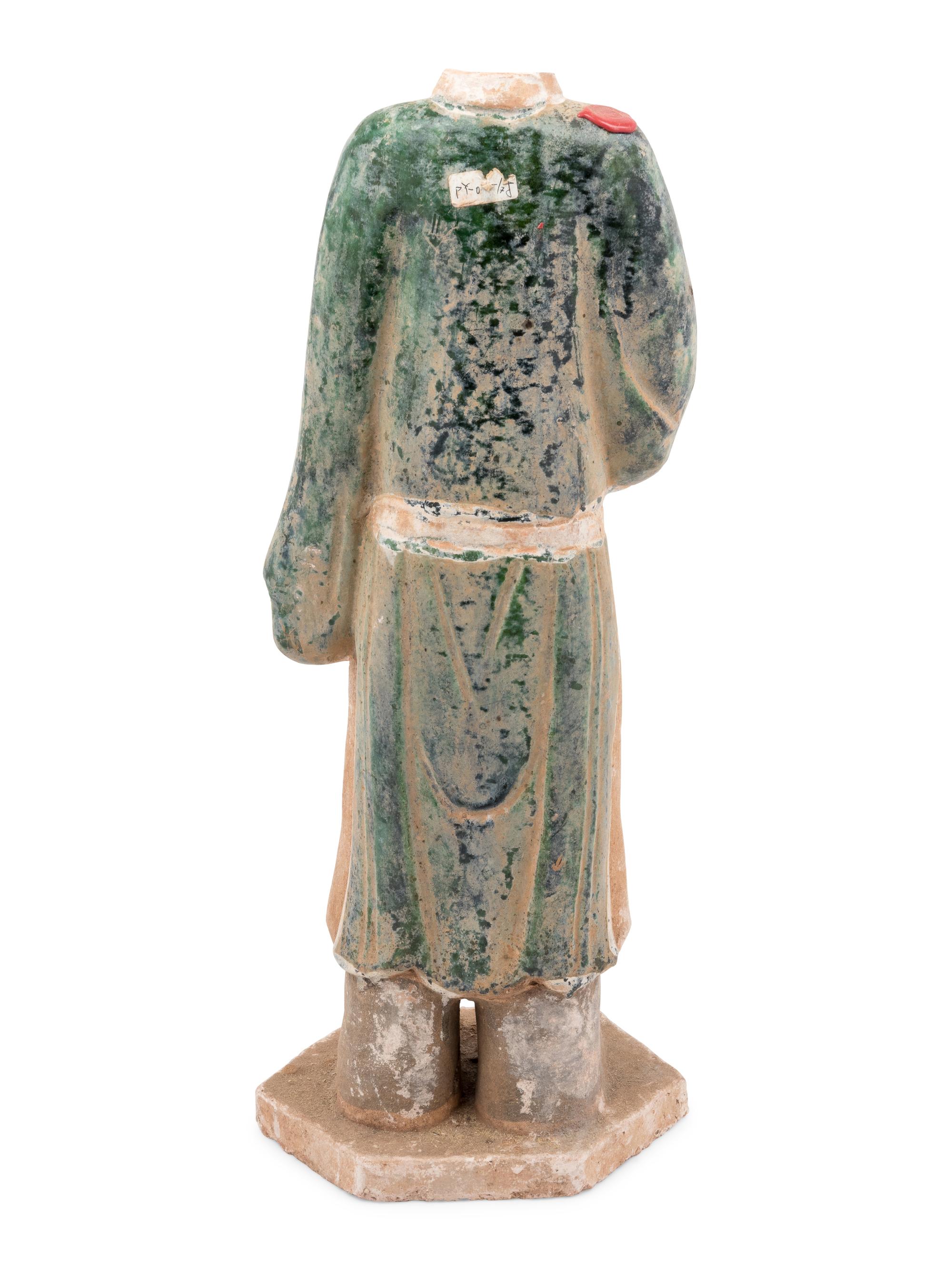 A Chinese Polychrome Decorated Terra Cotta Standing Figure
