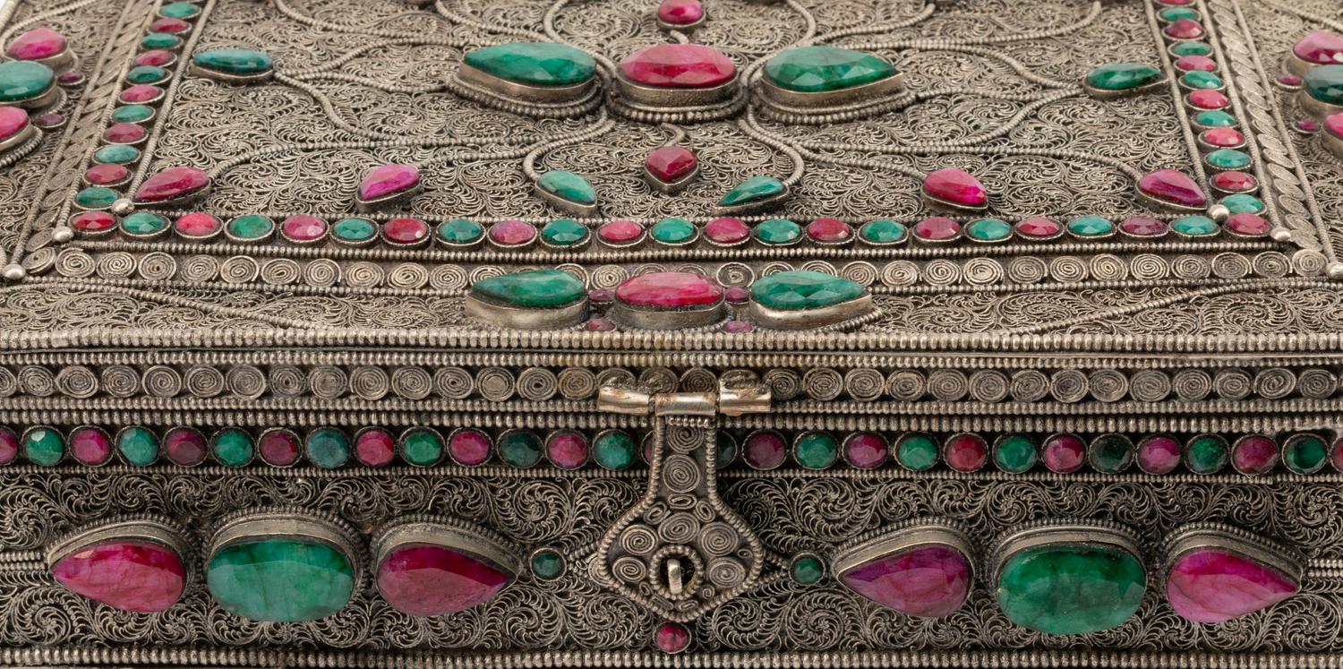 A Ruby and Emerald-Encrusted Silvered Metal Filigree Casket