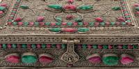 A Ruby and Emerald-Encrusted Silvered Metal Filigree Casket