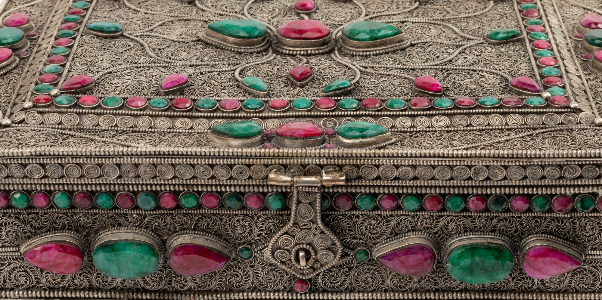 A Ruby and Emerald-Encrusted Silvered Metal Filigree Casket