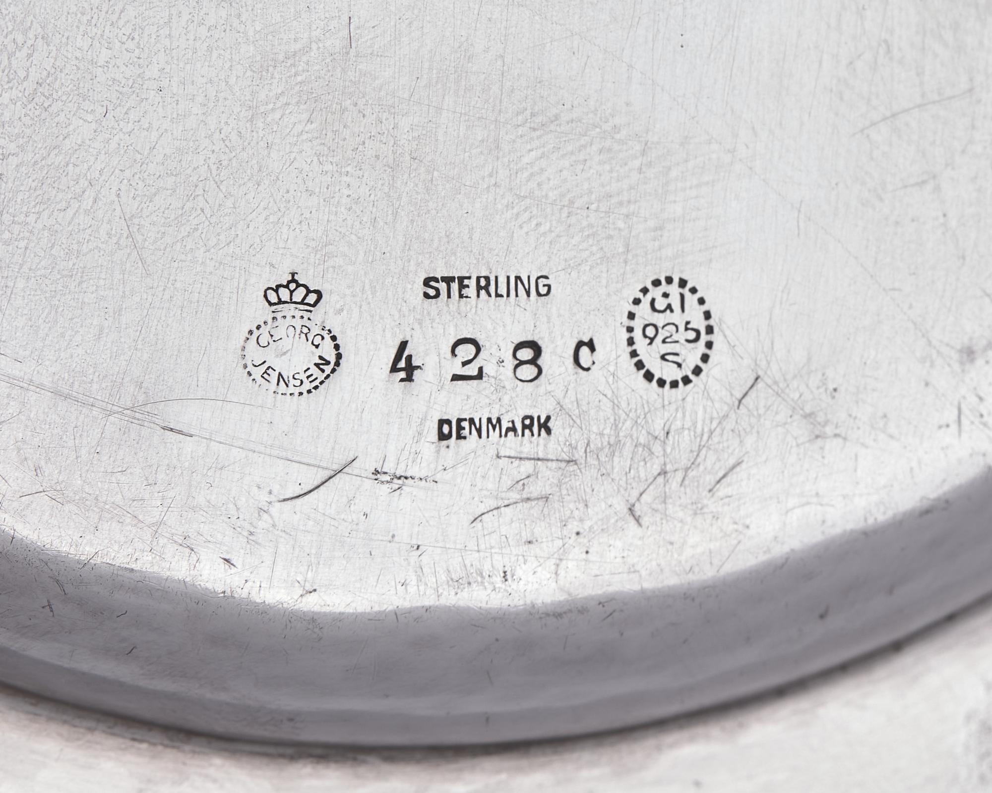A Set of Twelve Georg Jensen Silver Bread Plates