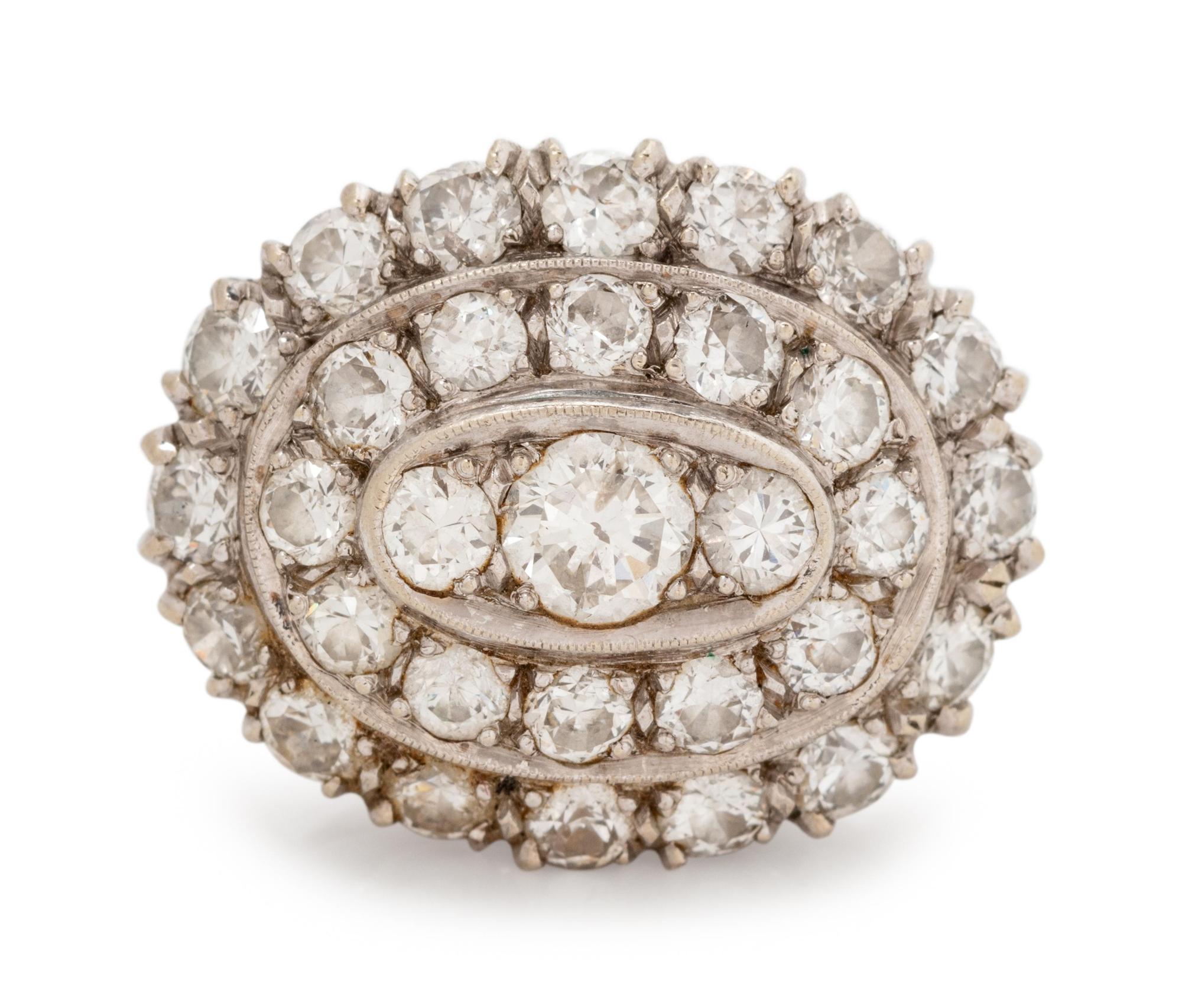 A 14 Karat White Gold and Diamond Ring,