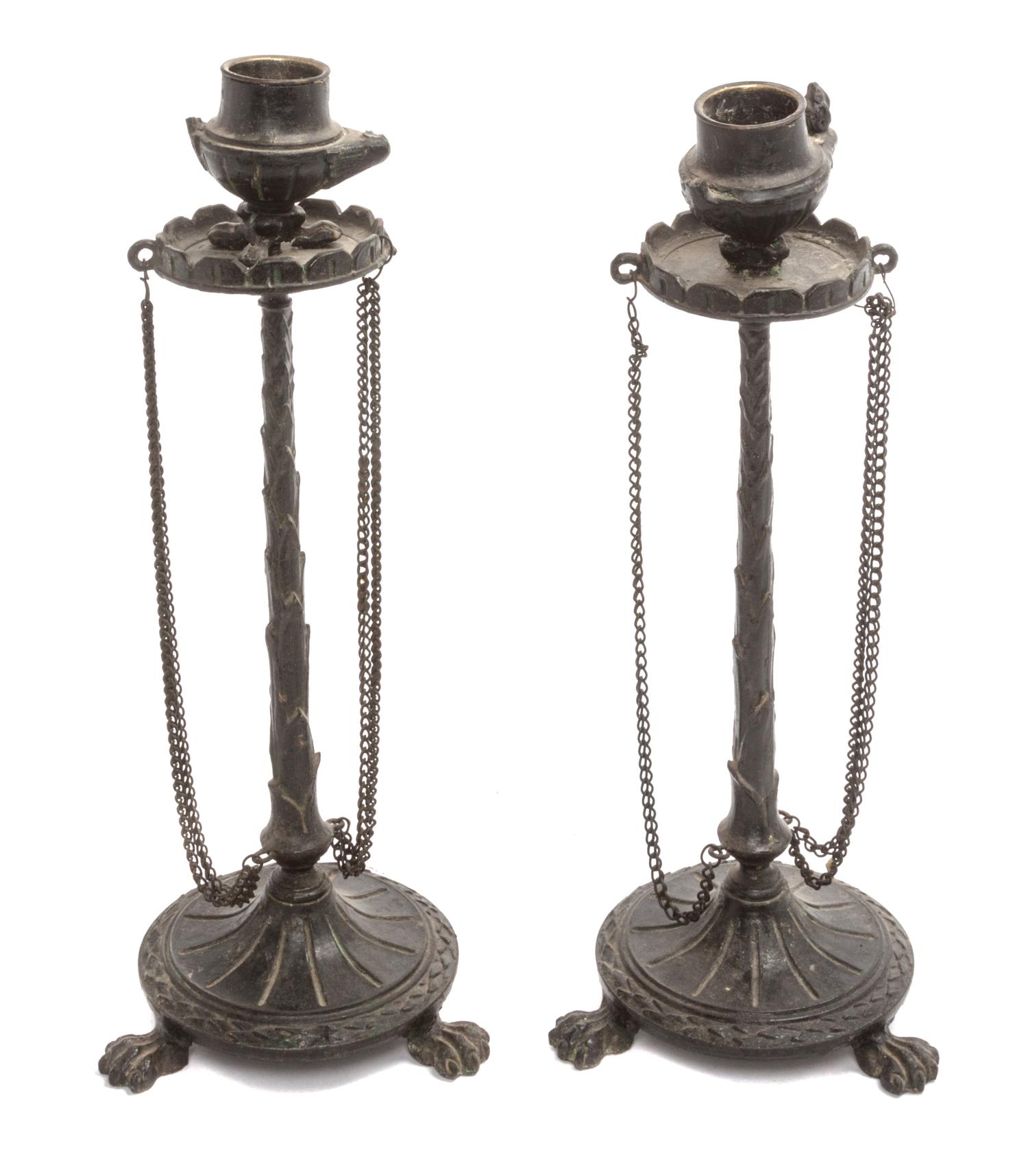 A Pair of Neoclassical Cast Metal Candlesticks Height 9 3/4 inches.