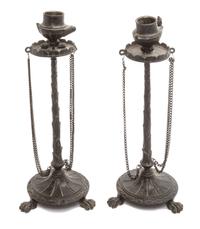 A Pair of Neoclassical Cast Metal Candlesticks Height 9 3/4 inches.