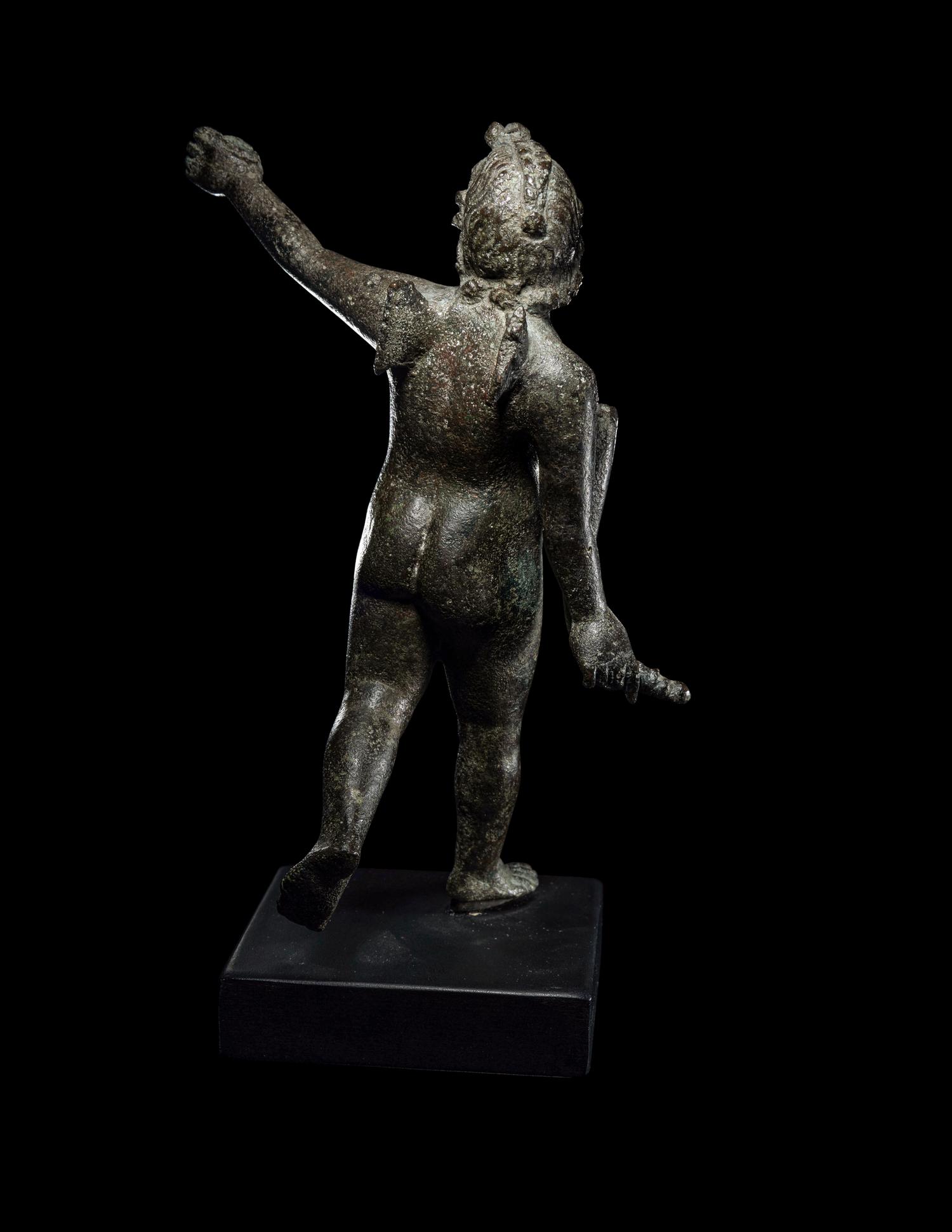 A Roman Bronze Nude Winged Eros