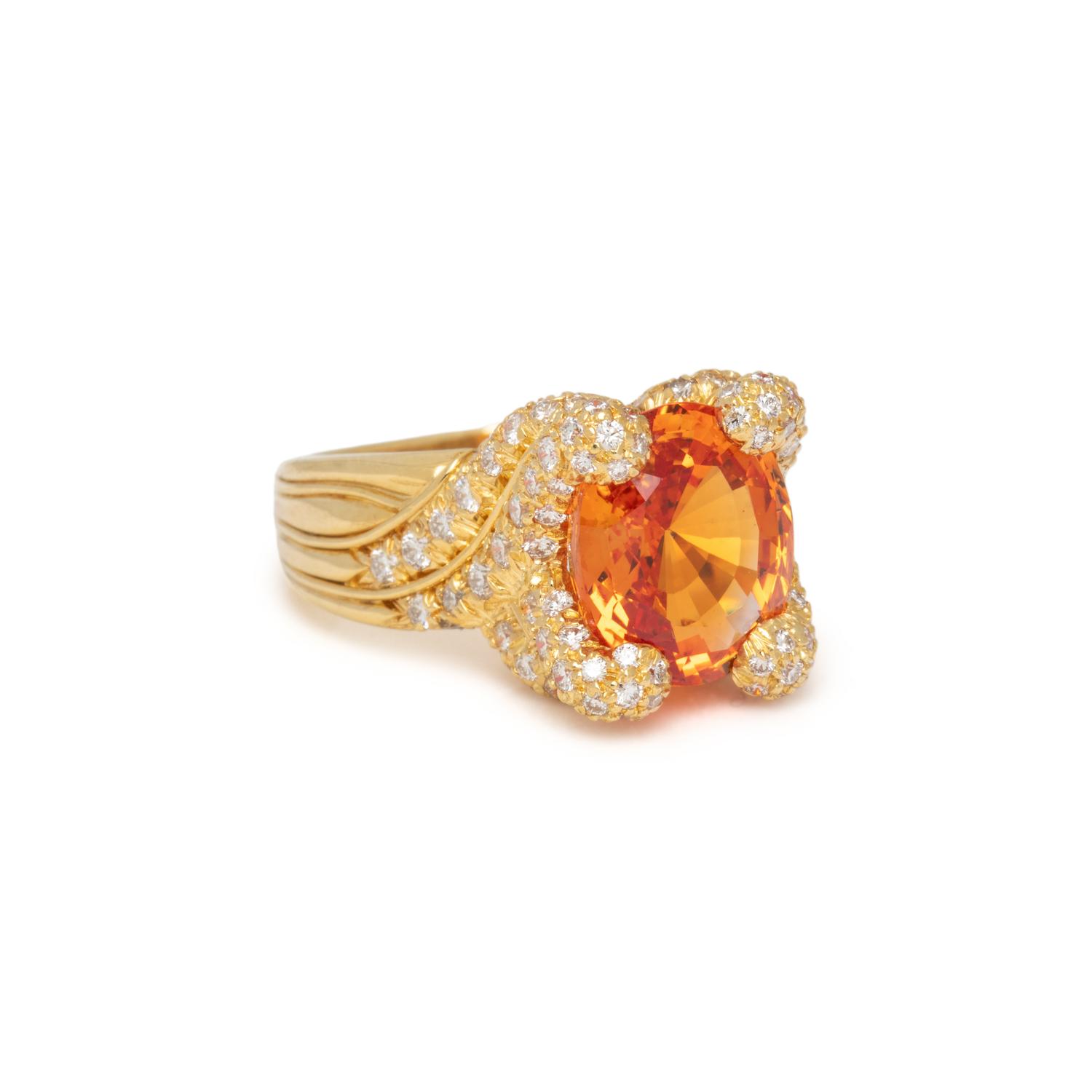 HENRY DUNAY, YELLOWISH ORANGE SAPPHIRE AND DIAMOND RING