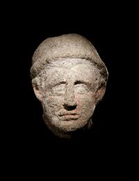 An Etruscan Over-Lifesized Nenfro Portrait Head of a Man
