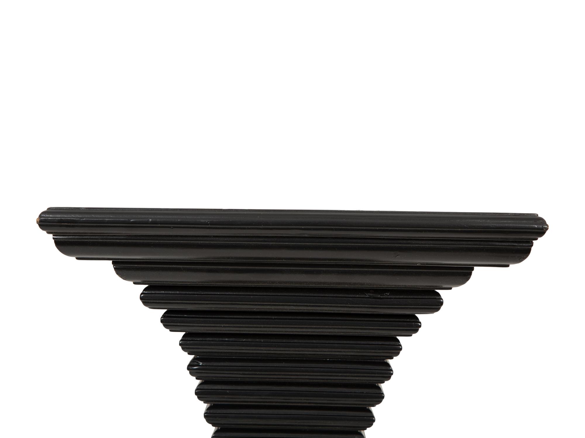 A Pair of Ebonized Wall Brackets