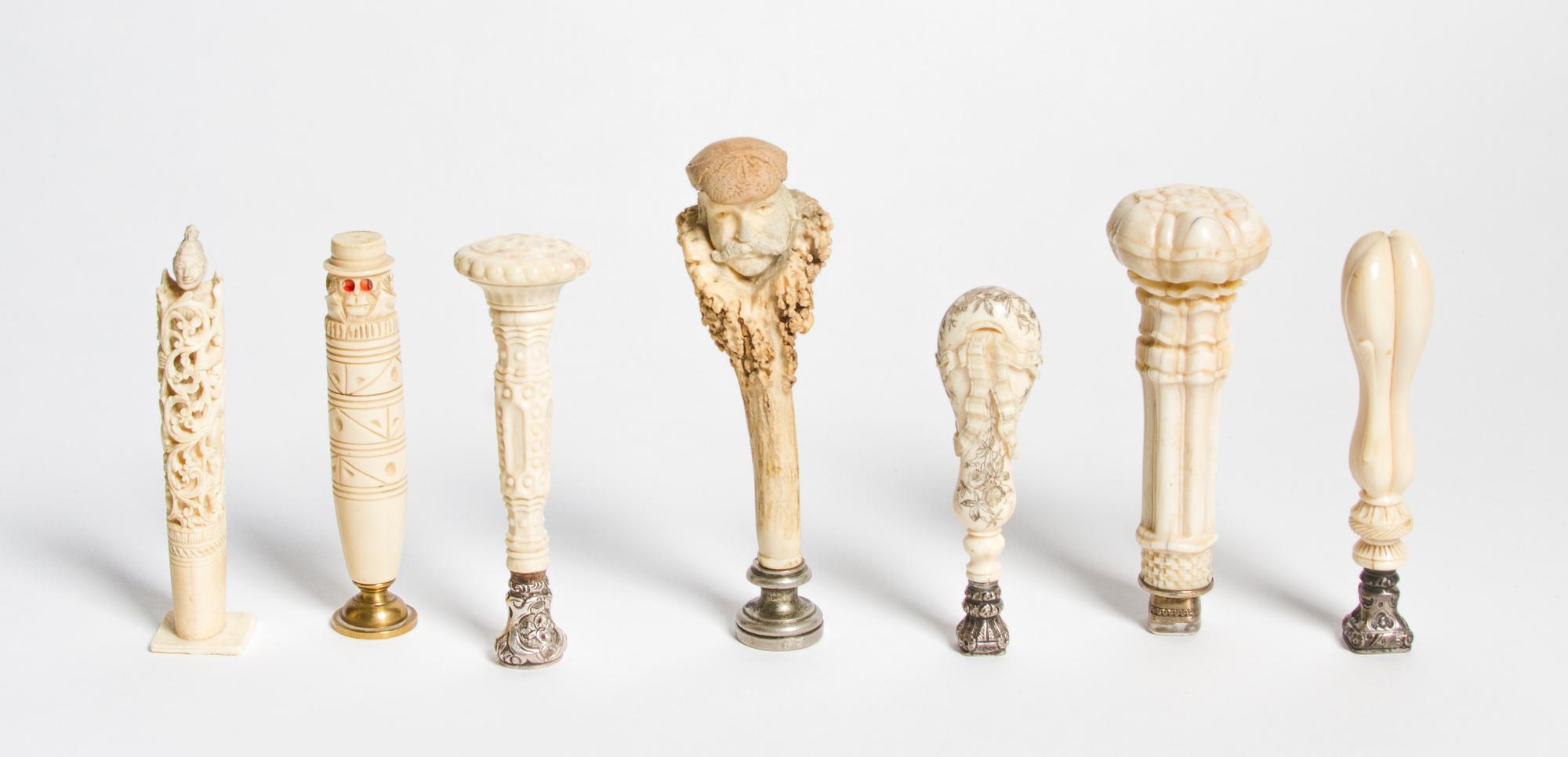 A Collection of Carved Ivory and Bone Seals, Height of tallest 4 3/4 inches.