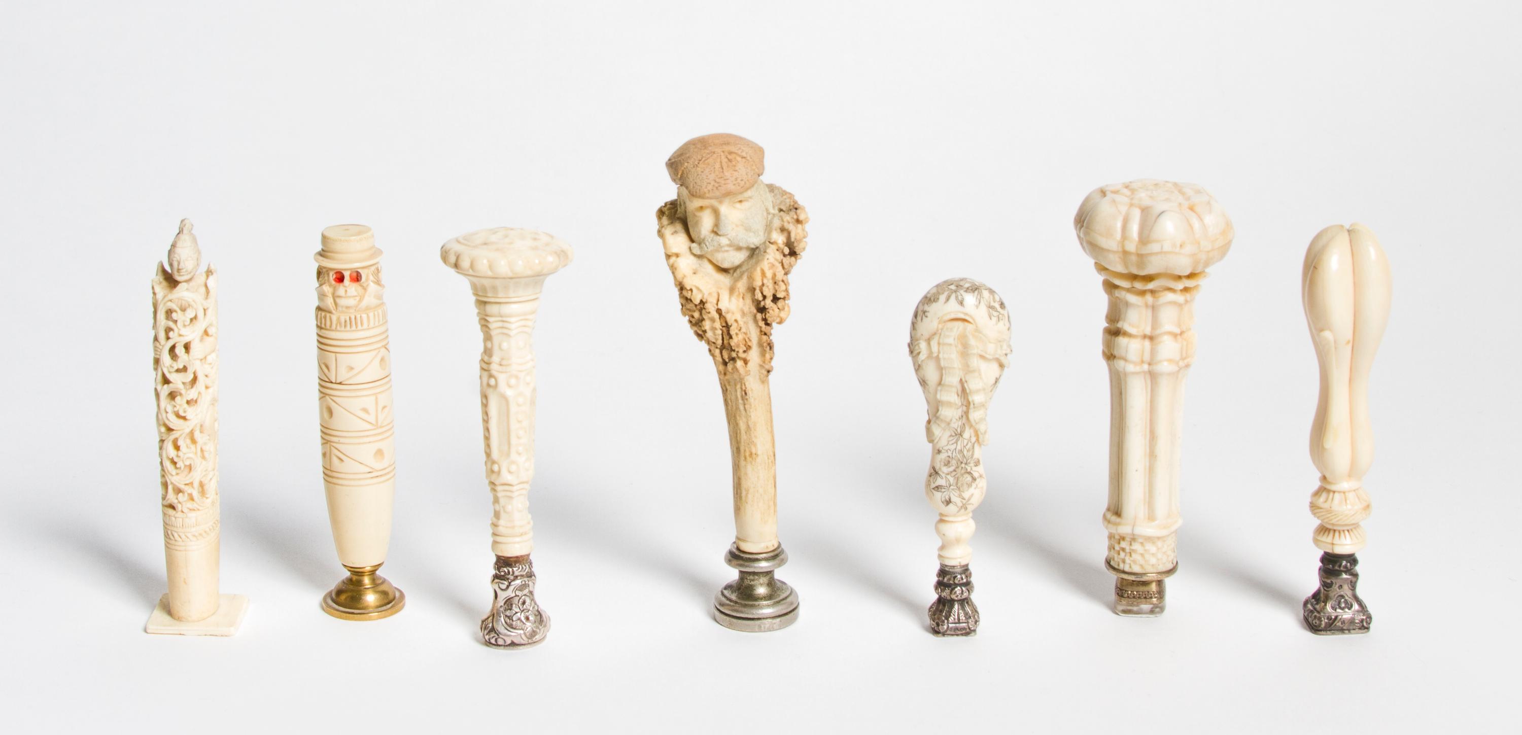 A Collection of Carved Ivory and Bone Seals, Height of tallest 4 3/4 inches.
