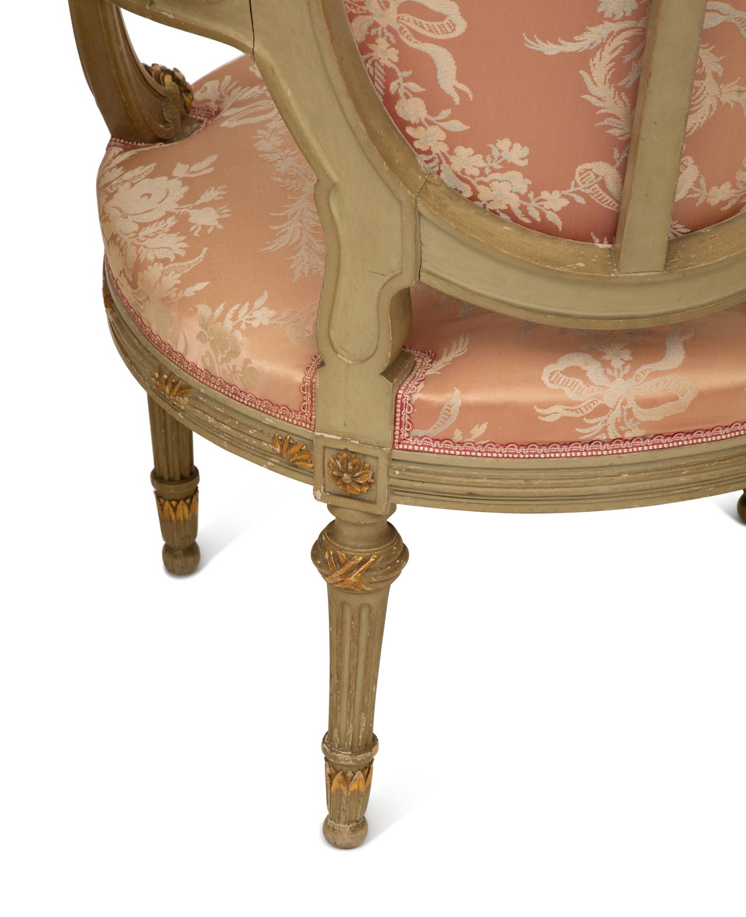 A Louis XVI Style Painted and Parcel Gilt Three-Piece Seating Suite