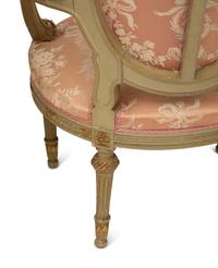 A Louis XVI Style Painted and Parcel Gilt Three-Piece Seating Suite