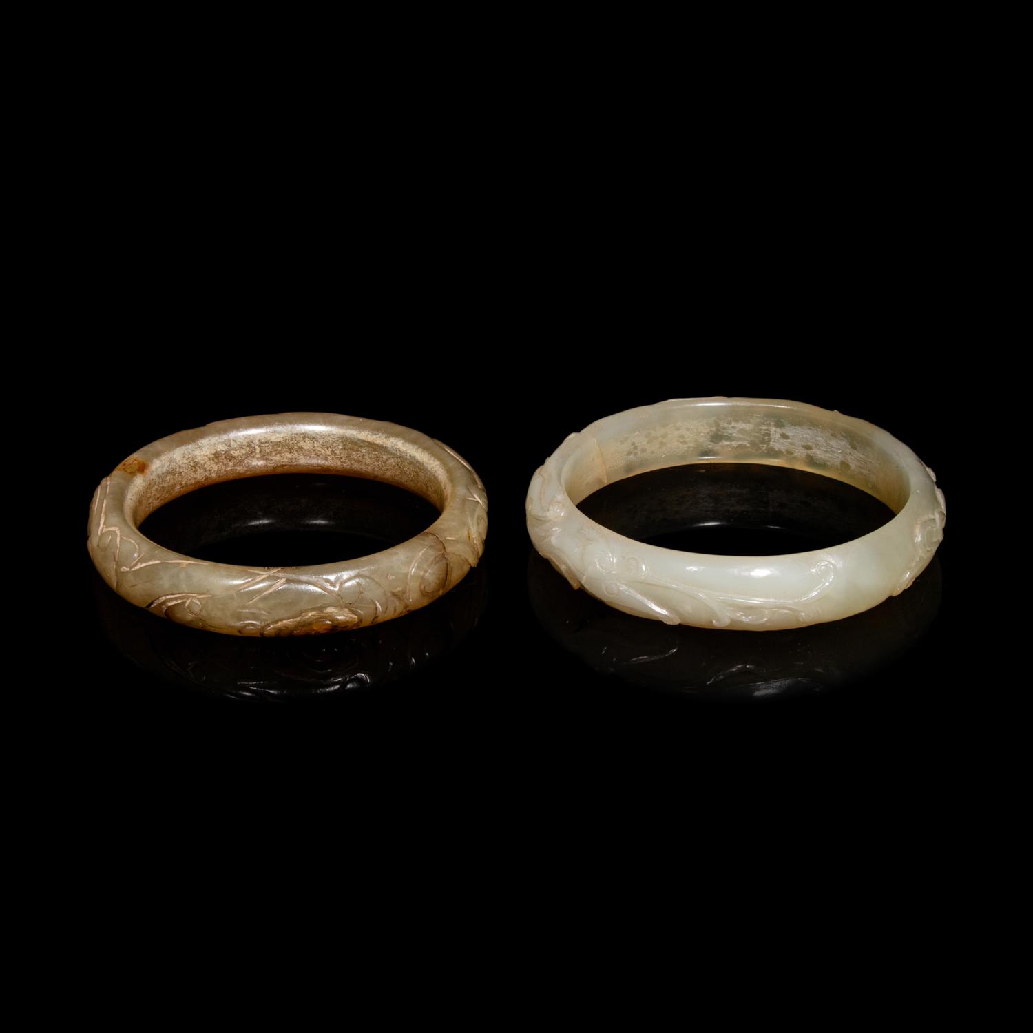 Two Chinese Carved Precious Stone Bangles, Qing Dynasty or Earlier 清或以前 青玉、瑪瑙雕螭龍紋鐲各一