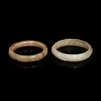 Two Chinese Carved Precious Stone Bangles, Qing Dynasty or Earlier 清或以前 青玉、瑪瑙雕螭龍紋鐲各一