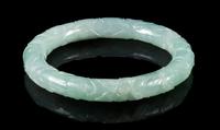 An Apple Green and Celadon Jadeite Bangle Interor diameter 2 1/4 inches.