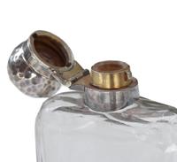 A James Dixon & Sons Hammered Silver and Glass Flask 2.5" W x 1" D x 4.5" H — England, Circa 1911