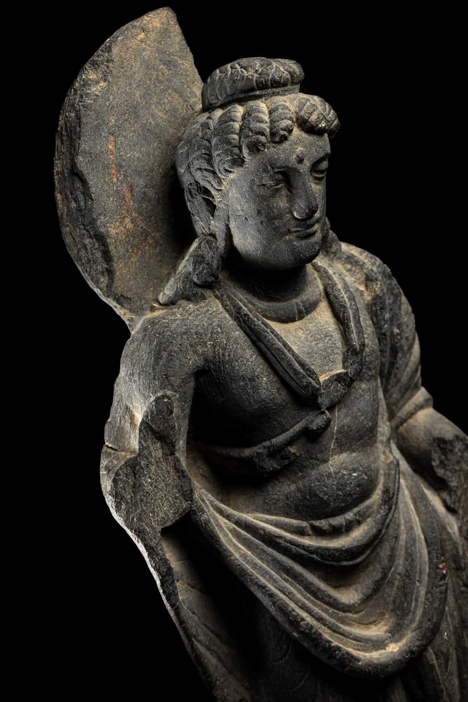 A Gandharan Grey Schist Figure of Maitreya
