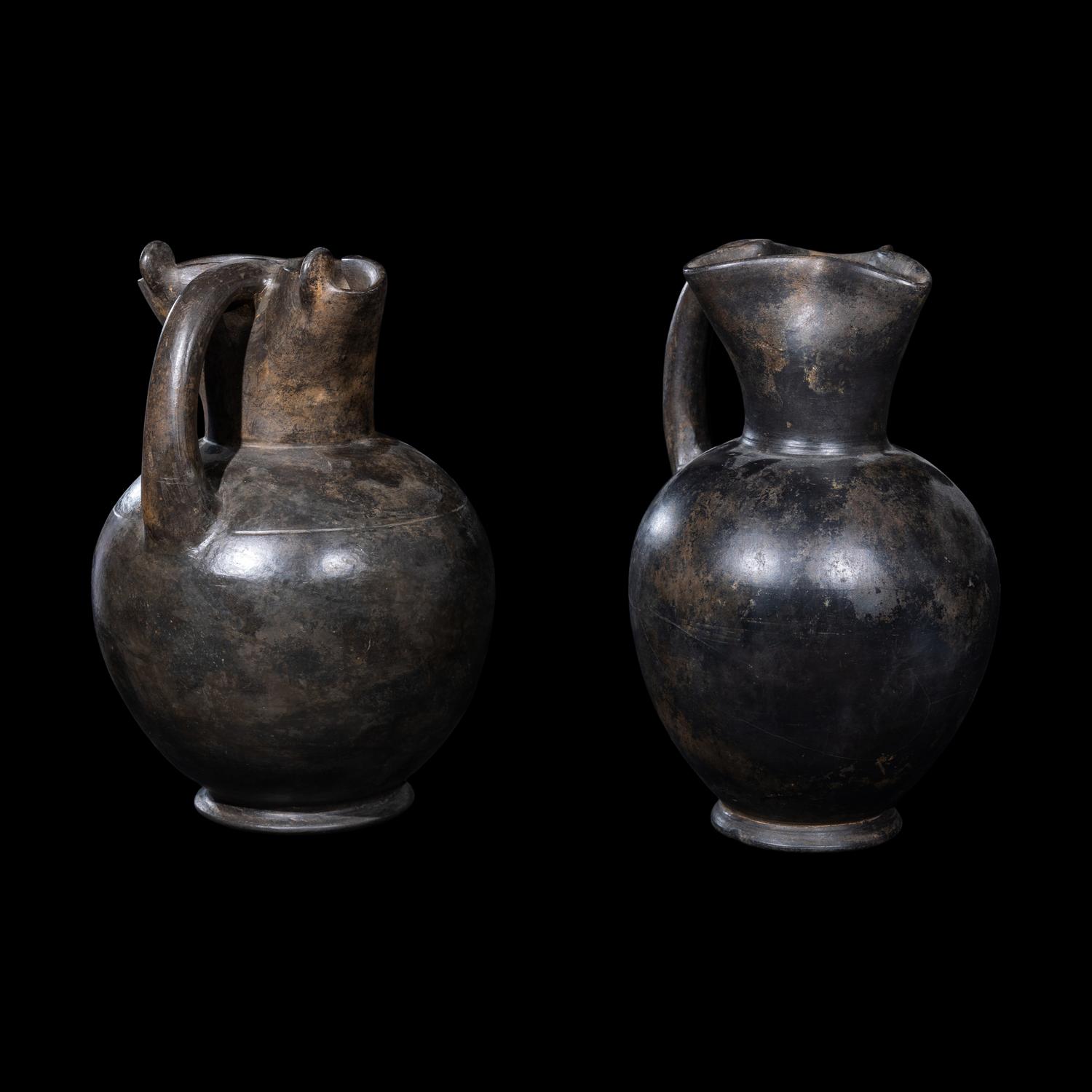 Two Etruscan Bucchero Oinochoai
