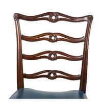 A Set of Four Early Federal Carved Mahogany Ladderback Side Chairs