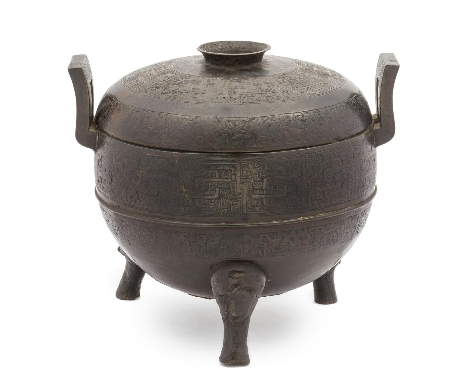 A Chinese Bronze Ritual Tripod Covered Vessel, Ding SONG/MING DYNASTY Height 9 3/4 inches x width 11 1/4 inches. — SONG/MING DYNASTY