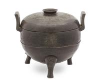 A Chinese Bronze Ritual Tripod Covered Vessel, Ding SONG/MING DYNASTY Height 9 3/4 inches x width 11 1/4 inches. — SONG/MING DYNASTY