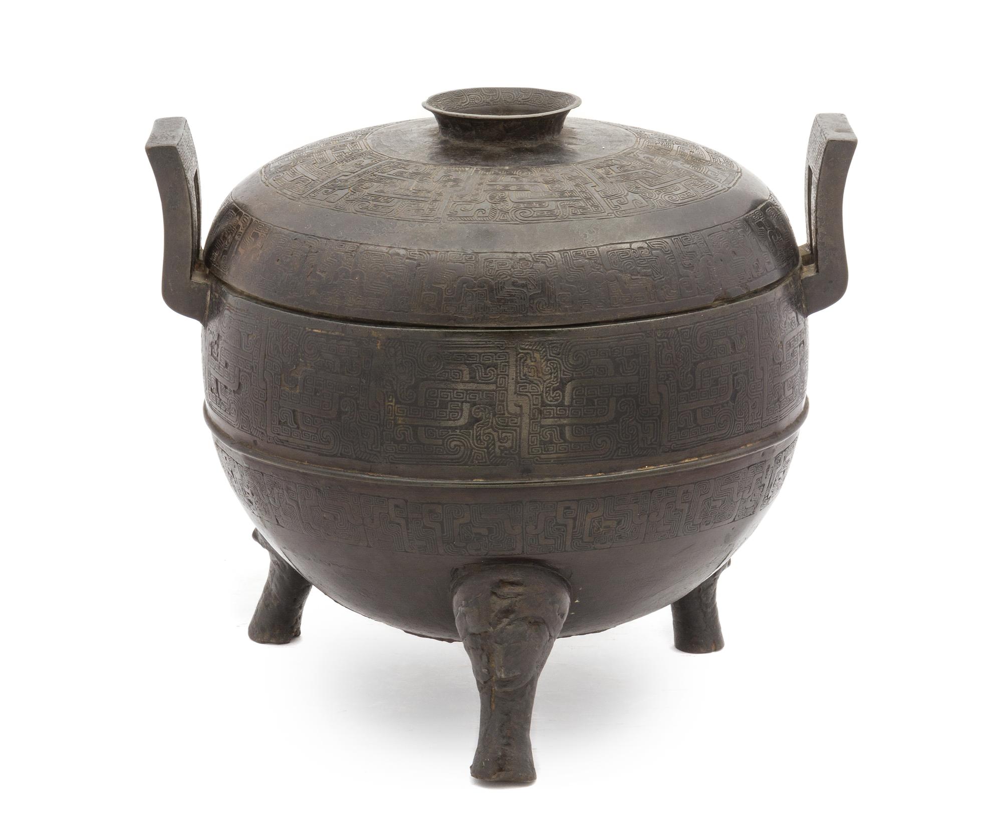 A Chinese Bronze Ritual Tripod Covered Vessel, Ding SONG/MING DYNASTY Height 9 3/4 inches x width 11 1/4 inches. — SONG/MING DYNASTY