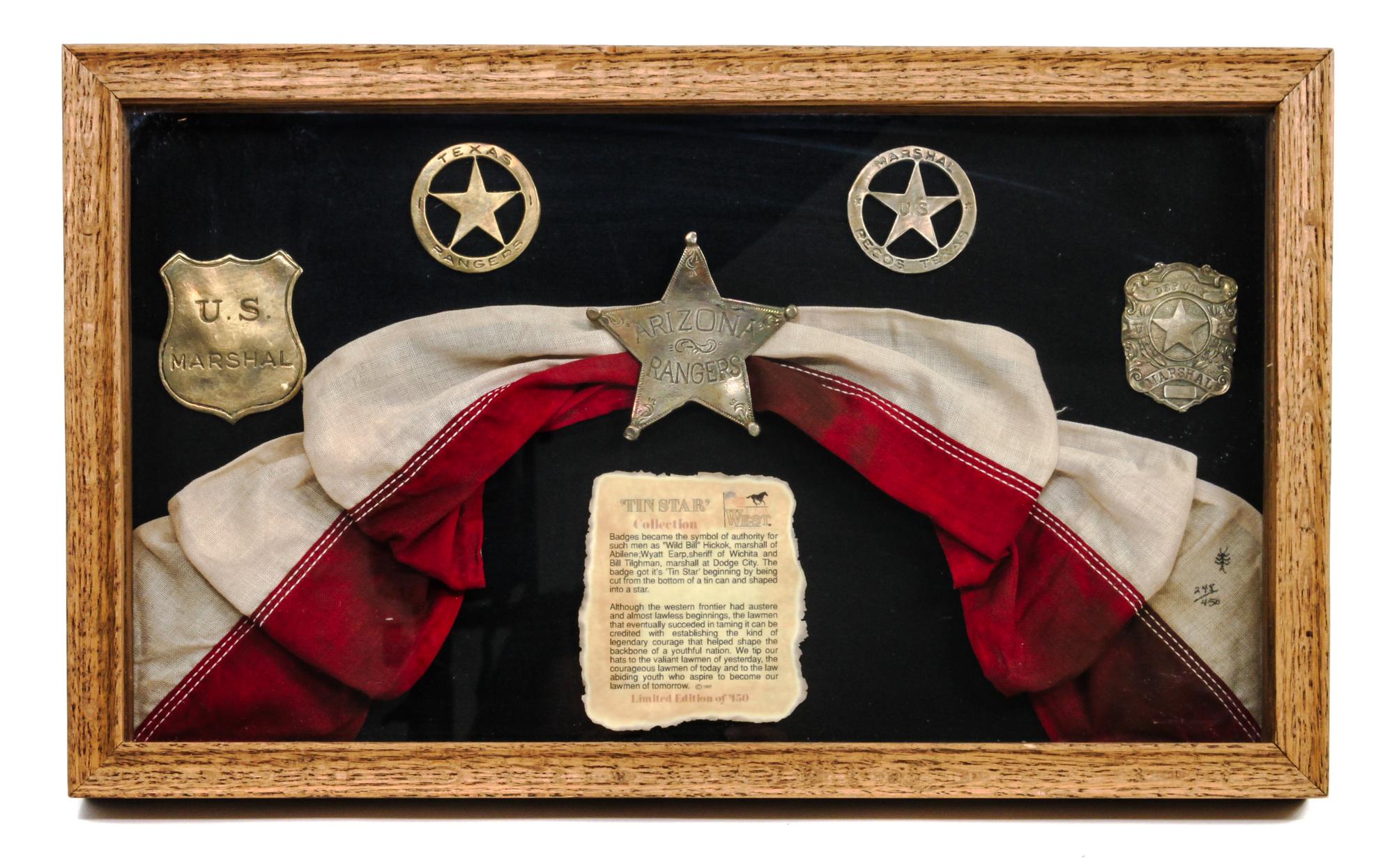 A Framed Collection of Contemporary "Tin Star" Marshall Badges First 10 1/4 x 17 inches.