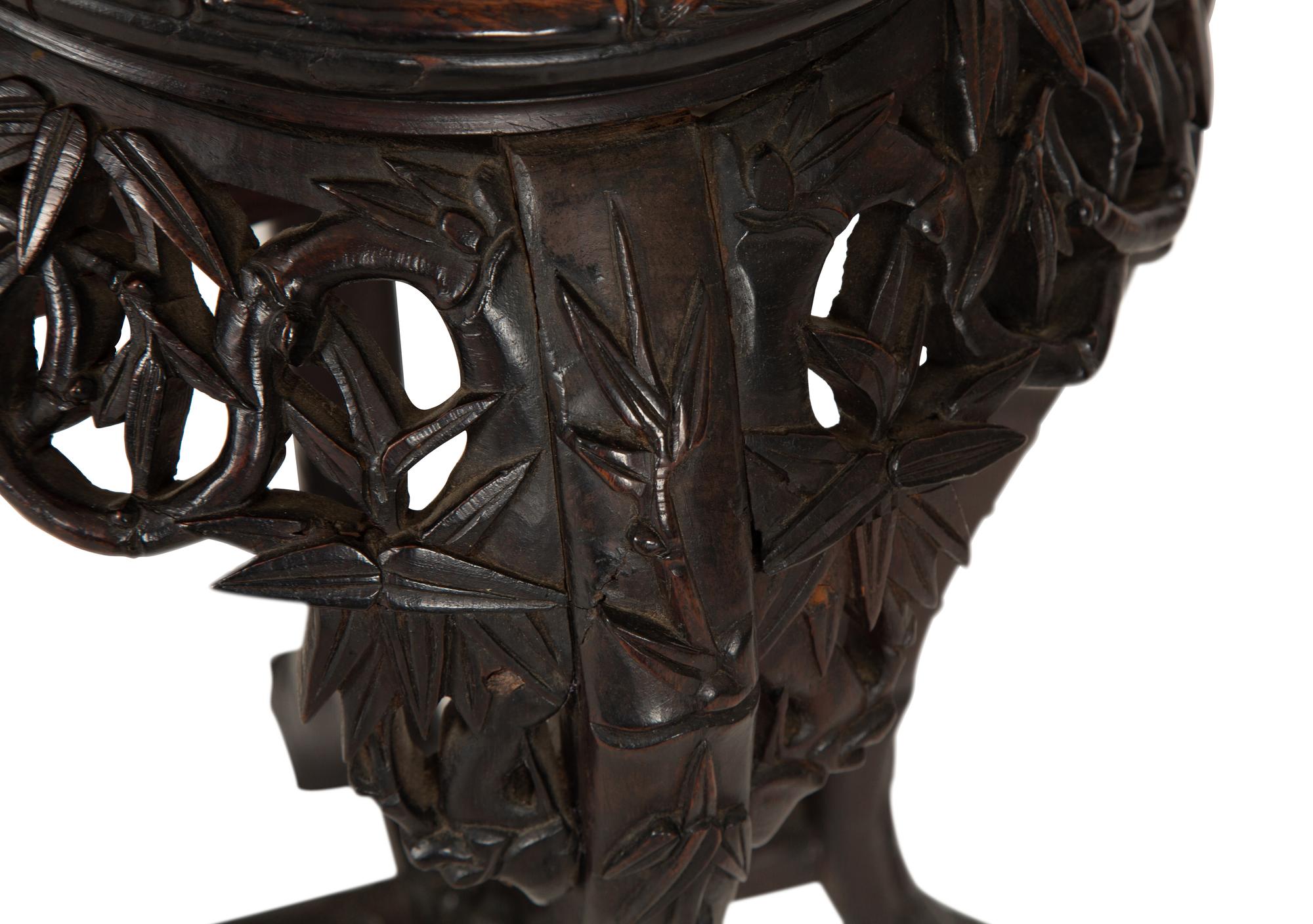 A Chinese Carved Hardwood Stand with Inset Marble Top