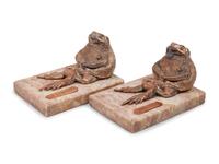 A Pair of Silvered Copper and Marble Bookends