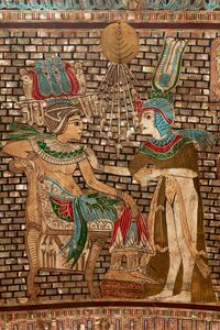 An Egyptian Style Parcel Gilt and Inlaid Throne Chair