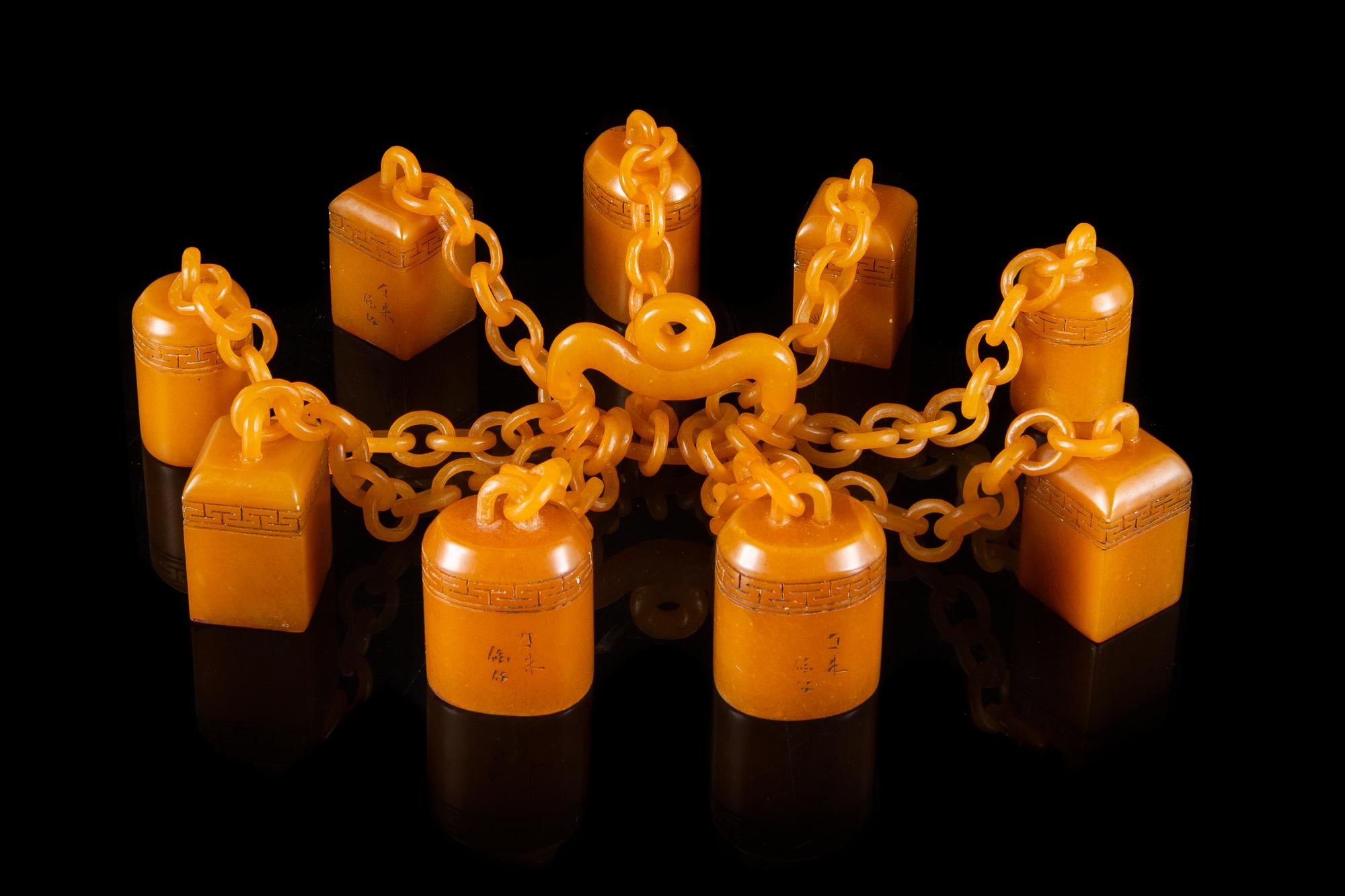 A Set of Nine Carved Yellow Soapstone Seals Height of tallest 1 3/4 inches.